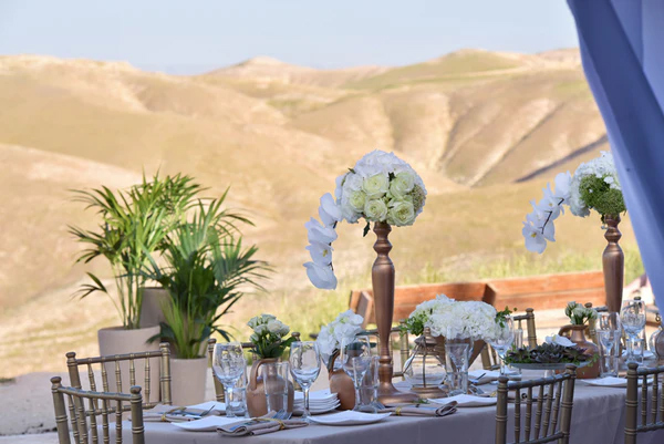 flowers at a wedding table with desert landscape background