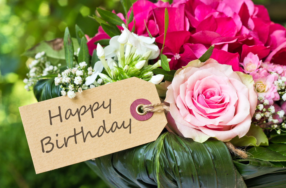 https://bouqs.com/blog/wp-content/uploads/2018/10/history-happy-birthday-flowers.jpg