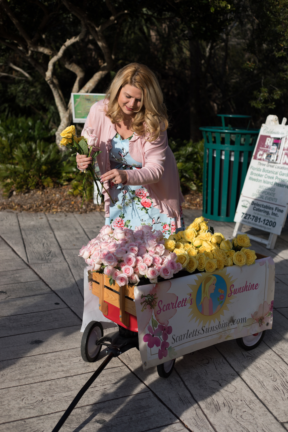 Woman Arranging Roses in Wagon