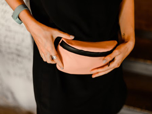 New fanny pack being worn by working woman.