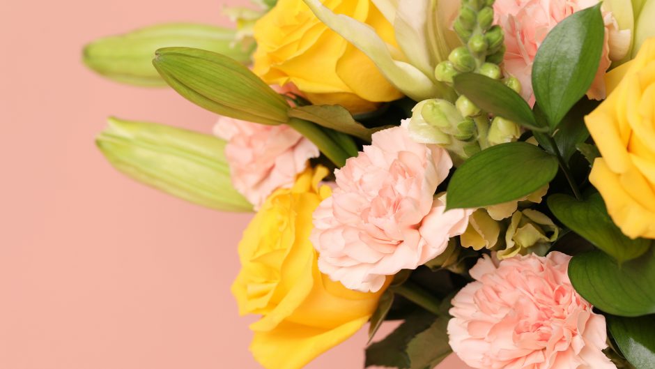 close up image with yellow and peach flowers