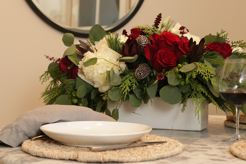 holiday centerpiece with red and white flowers