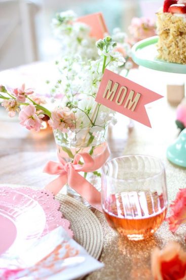 tea and flowers with a banner that reads "MOM"