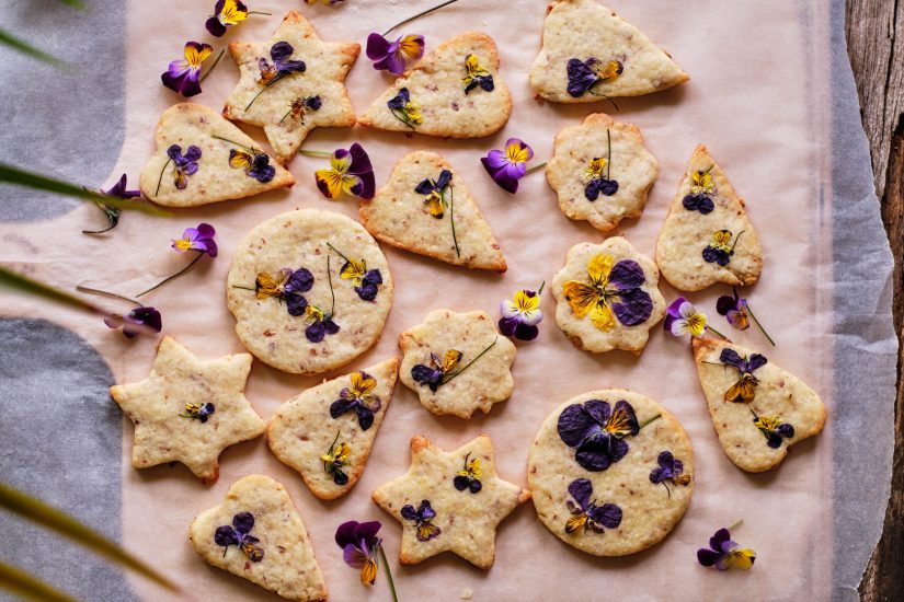 Batch of cookies with flowers pressed into them