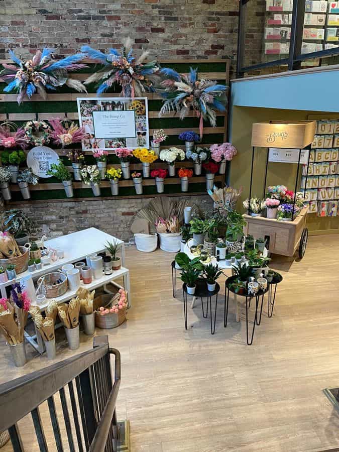 Floral display with company pictureboard
