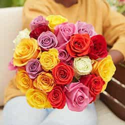 woman holding a multicolor rose bouquet