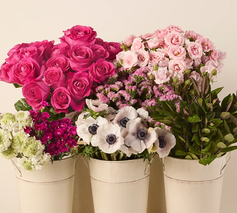 Bulk Hot pink roses, light pink spray roses, anenomes, and more flowers arranged in tin buckets