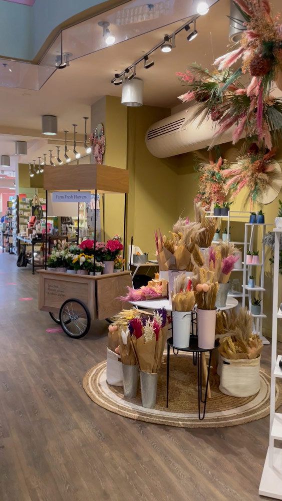 Floral display with company pictureboard