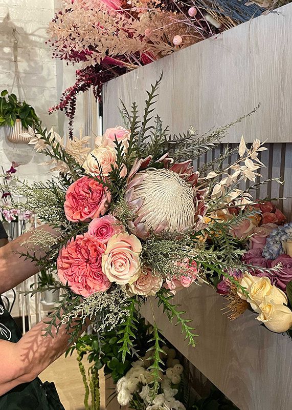 Peach and pink king protea bouquet