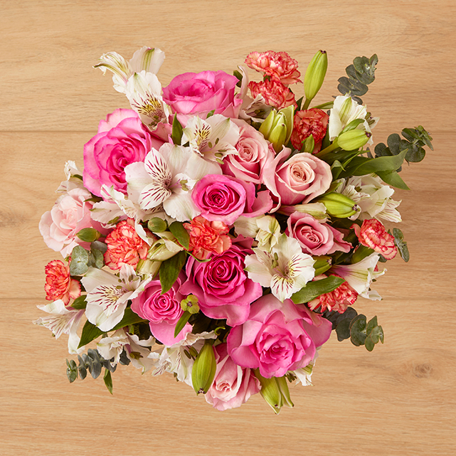 flower arrangement of pink lilies and roses