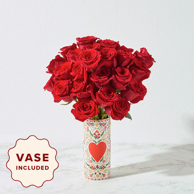 Vased bouquet of a dozen red roses.