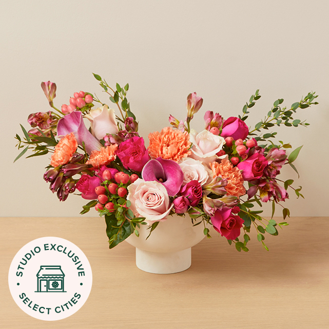 Bright organic flower arrangement in pinks, oranges and whites