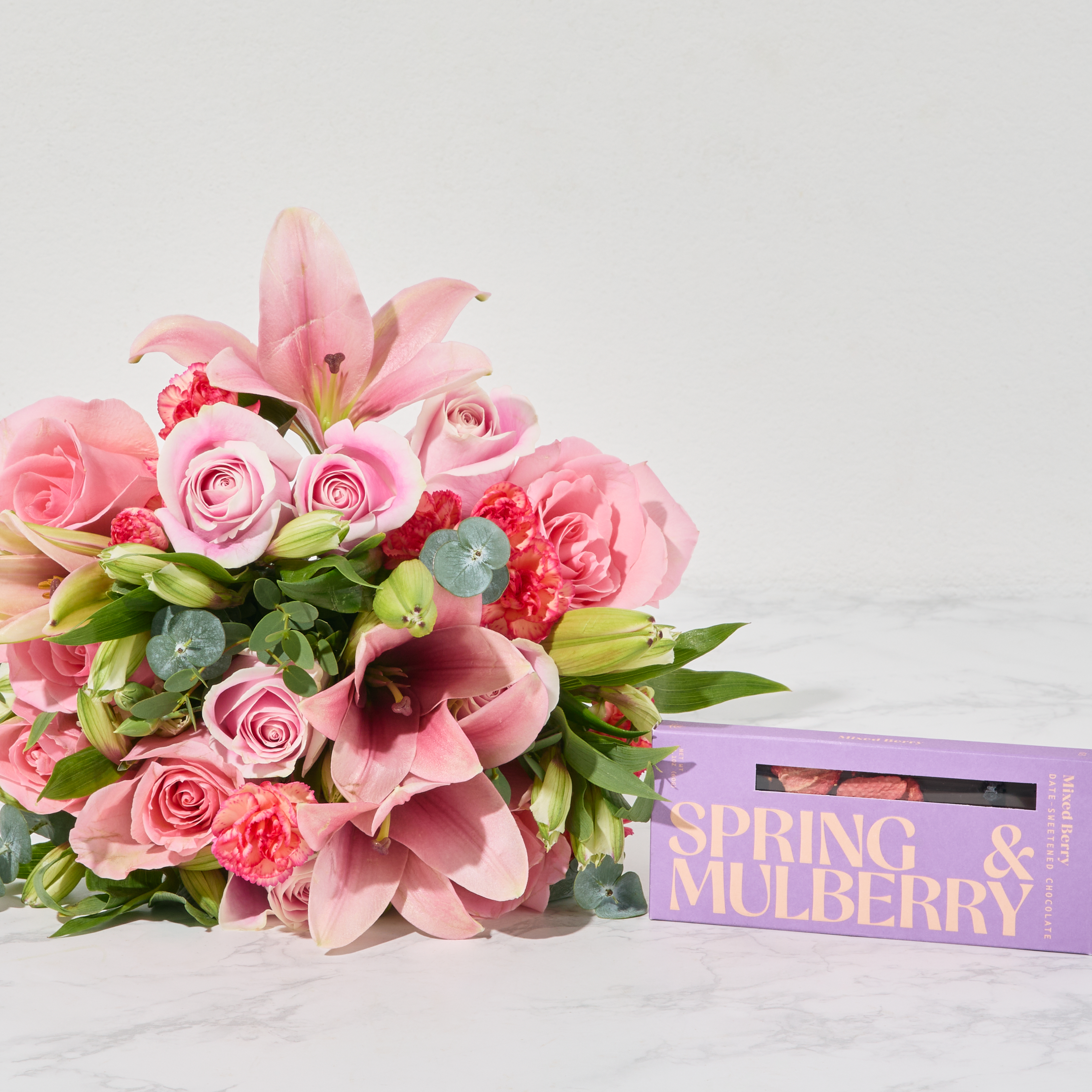 A bright spring bouquet with a Spring & Mulberry chocolate bar.