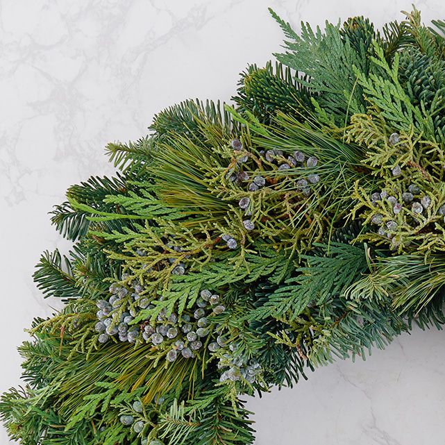 Juniper Holiday Wreath With Decorative Berries The Bouqs Co.