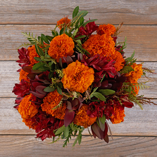 orange marigold and red alstroemeria flower arrangement
