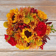 coral berry, pale orange marigold, safari sunset and tulip bouquet