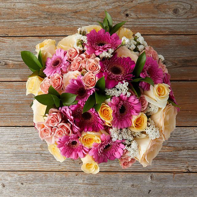 Pink Mini Gerberas with Cream or Peach Roses - The Bouqs Co.