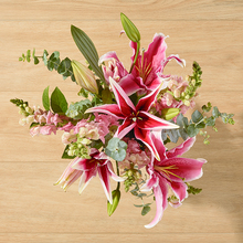ruby pink to white lily bouquet with pink snapdragons and greenery