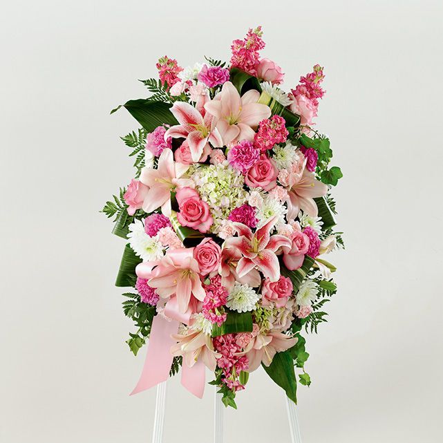 Standing funeral wreath with pink and white mixed flowers