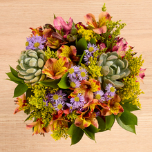 colorful alstroemeria, purple aster, yellow solidago and succulent bouquet