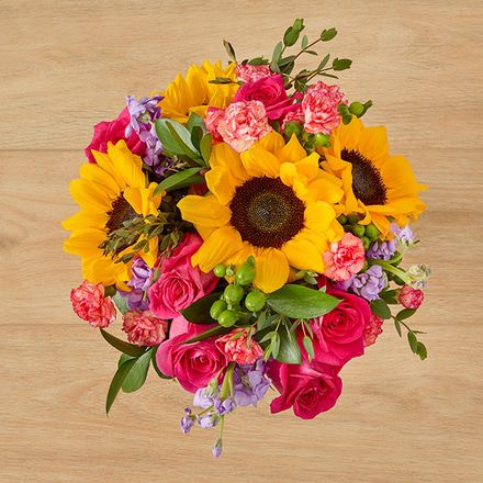A Sunny Mix of Sunflowers, Dark Pink Roses and Berries