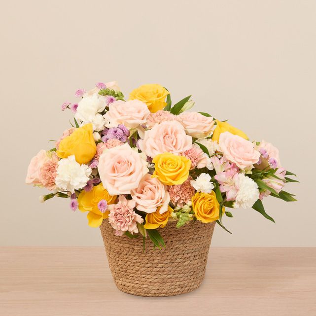 mixed floral arrangement in yellow, white, pink and other pastel colors