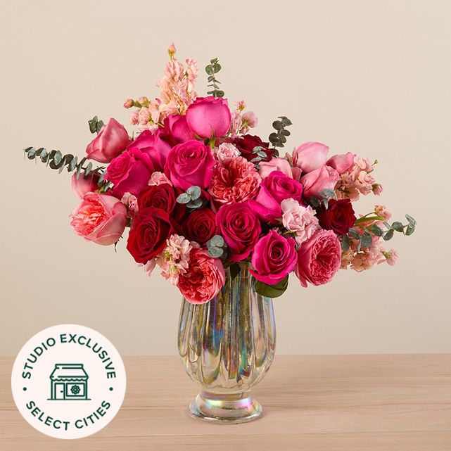 Gorgeous Red and Peach Roses with Eucalyptus Basket