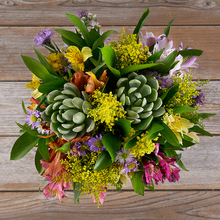 colorful alstroemeria, purple aster, yellow solidago and succulent bouquet